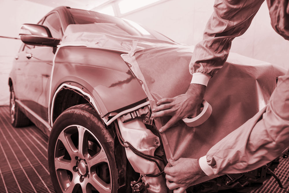 Car with body being repaired in auto shop